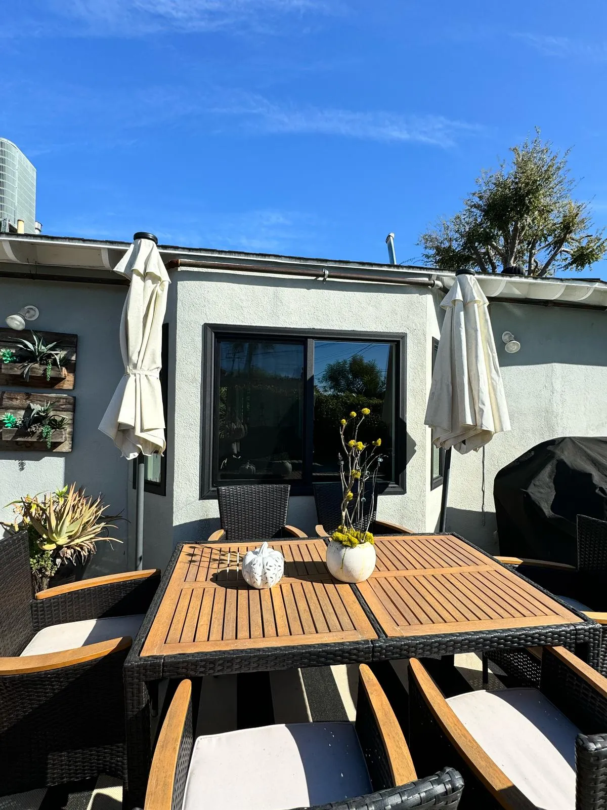 Teak outdoor dining set on the finished patio