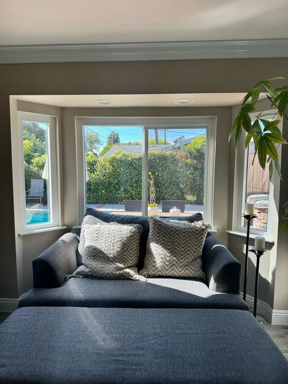 Bay window reading nook with garden view