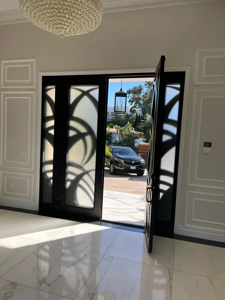 Designer double iron entry doors with decorative glass